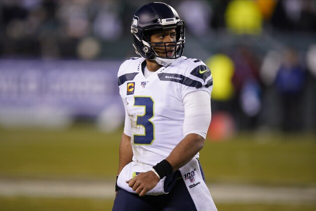 Seattle Seahawks' Russell Wilson walks to the sidelines during the first half of an NFL wild-card playoff football game against the Philadelphia Eagles, Sunday, Jan. 5, 2020, in Philadelphia. (AP Photo/Chris Szagola)