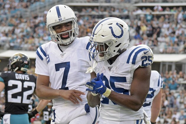 Indianapolis Colts quarterback Jacoby Brissett (7) congratulates running back Marlon Mack on his 5-yard touchdown run against the Jacksonville Jaguars during the first half of an NFL football game, Sunday, Dec. 29, 2019, in Jacksonville, Fla. (AP Photo/Phelan M. Ebenhack)