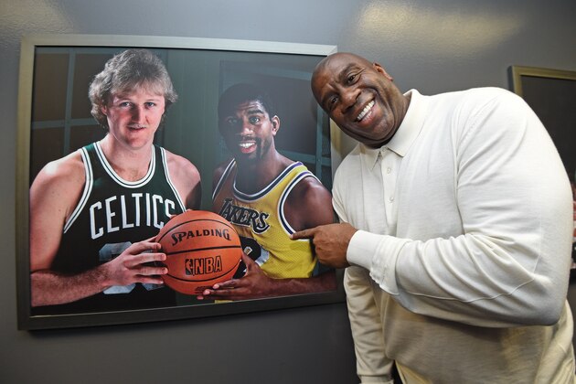 LOS ANGELES, CA - FEBRUARY 23: NBA legend Magic Johnson poses with a portrait of him and Larry Bird on February 23, 2020 at STAPLES Center in Los Angeles, California. NOTE TO USER: User expressly acknowledges and agrees that, by downloading and/or using this Photograph, user is consenting to the terms and conditions of the Getty Images License Agreement. Mandatory Copyright Notice: Copyright 2020 NBAE (Photo by Andrew D. Bernstein/NBAE via Getty Images)