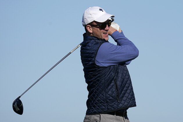 Peyton Manning follows his drive from the 16th tee of the Monterey Peninsula County Club Shore Course during the second round of the AT&T Pebble Beach National Pro-Am golf tournament Friday, Feb. 7, 2020, in Pebble Beach, Calif. (AP Photo/Tony Avelar)