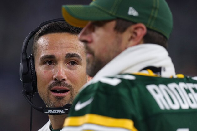 ARLINGTON, TEXAS - OCTOBER 06: Head coach Matt LaFleur of the Green Bay Packers  talks with quarterback Aaron Rodgers #12 on the sidelines during the game against the Dallas Cowboys at AT&T Stadium on October 06, 2019 in Arlington, Texas. (Photo by Richard Rodriguez/Getty Images)