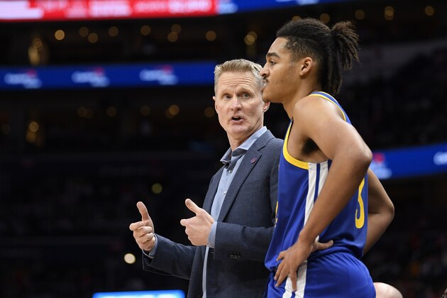 Golden State Warriors head coach Steve Kerr, left, talks with guard Jordan Poole, right, during the first half of an NBA basketball game against the Washington Wizards, Monday, Feb. 3, 2020, in Washington. (AP Photo/Nick Wass)