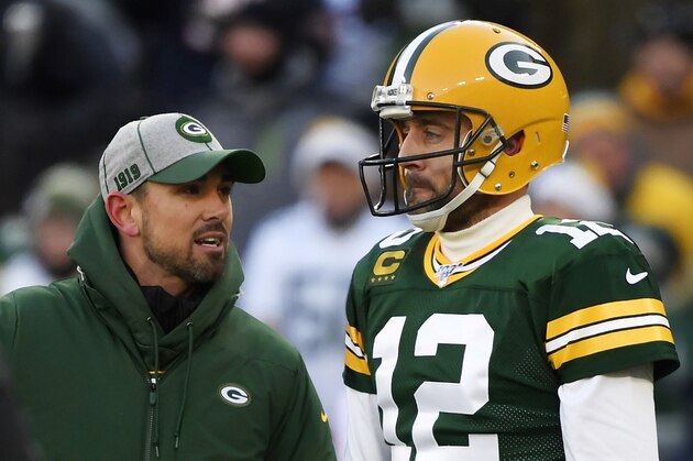 GREEN BAY, WISCONSIN - DECEMBER 15: head coach Matt LaFleur of the Green Bay Packers discusses with Aaron Rodgers #12 of the Green Bay Packers during warms up before the game against the Chicago Bears at Lambeau Field on December 15, 2019 in Green Bay, Wisconsin. (Photo by Quinn Harris/Getty Images)