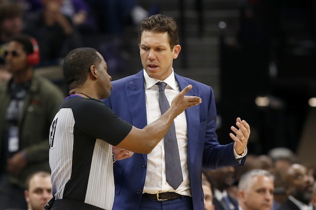 Sacramento Kings head coach Luke Walton, right, discusses a call with referee Mitchell Ervin during the second half of an NBA basketball game against the Toronto Raptors in Sacramento, Calif., Sunday, March 8, 2020. The Raptors won 118-113. (AP Photo/Rich Pedroncelli)