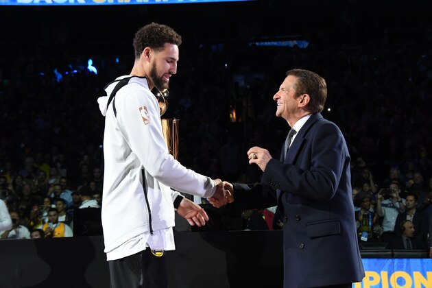OAKLAND, CA - OCTOBER 16:  Klay Thompson #11 of the Golden State Warriors receives his 2018 NBA finals Championship ring from Owner Peter Guber on October 16, 2018 at ORACLE Arena in Oakland, California. NOTE TO USER: User expressly acknowledges and agrees that, by downloading and or using this photograph, user is consenting to the terms and conditions of Getty Images License Agreement. Mandatory Copyright Notice: Copyright 2018 NBAE (Photo by Andrew D. Bernstein/NBAE via Getty Images)