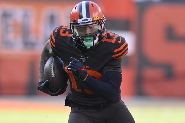 Cleveland Browns wide receiver Odell Beckham Jr. runs with the ball during an NFL football game against the Baltimore Ravens, Sunday, Dec. 22, 2019, in Cleveland. The Ravens won 31-15. (AP Photo/David Richard)