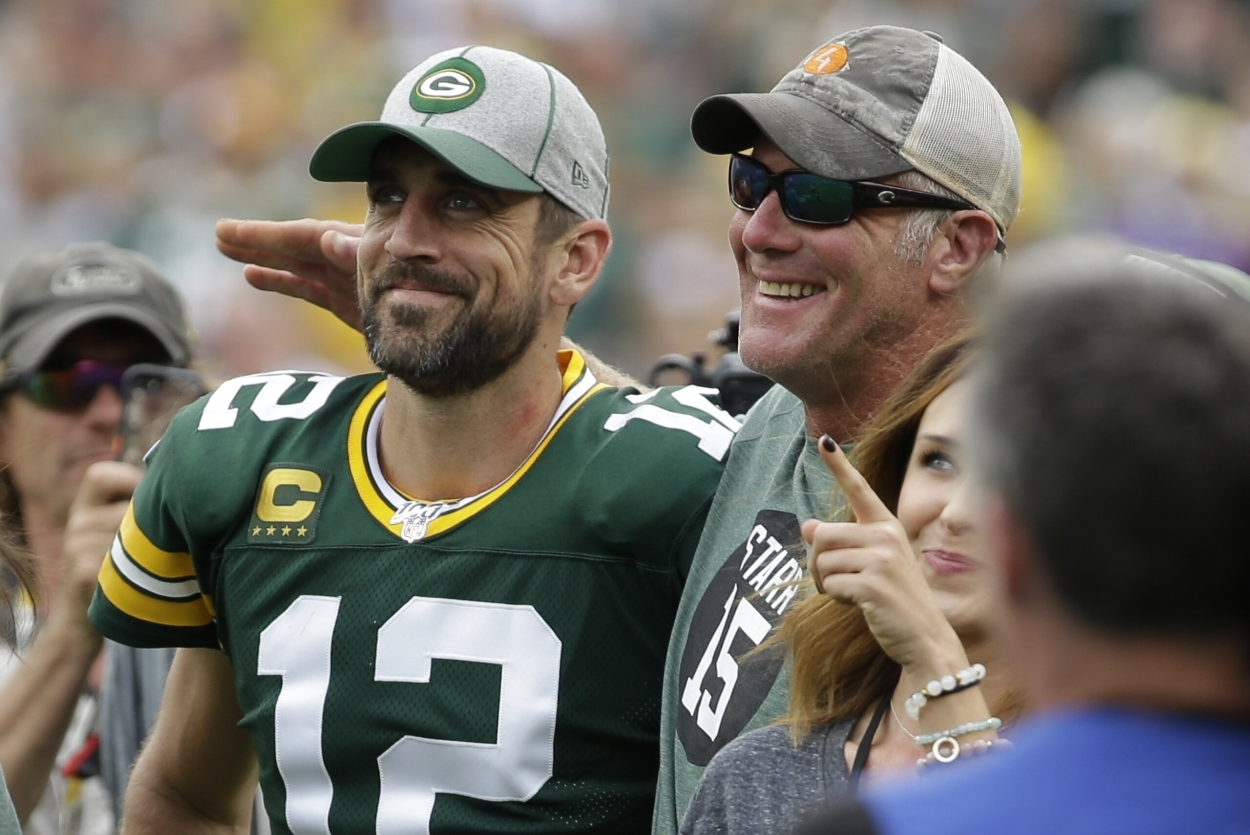 Green Bay Packers' Aaron Rodgers smiles with former quarterback Brett Favre during halftime of an NFL football game against the Minnesota Vikings Sunday, Sept. 15, 2019, in Green Bay, Wis. (AP Photo/Mike Roemer)