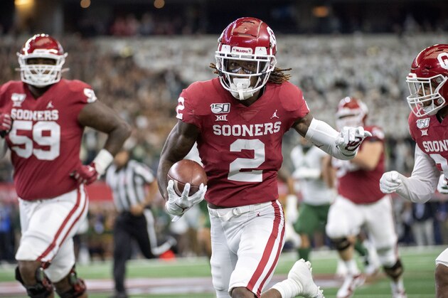 Oklahoma wide receiver CeeDee Lamb (2) runs upfield with a reception during the first half of an NCAA college football game against Baylor for the Big 12 Conference championship, Saturday, Dec. 7, 2019, in Arlington, Texas. (AP Photo/Jeffrey McWhorter)