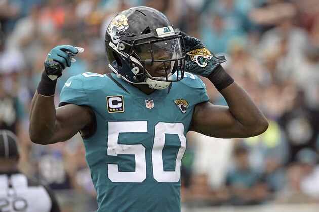 FILE - In this Sept. 16, 2018, file photo, Jacksonville Jaguars linebacker Telvin Smith (50) gestures to fans during the first half of an NFL football game against the New England Patriots in Jacksonville, Fla. Smith, the team’s leading tackler the last two seasons and a Pro Bowl selection in 2017, is stepping away from football to “give this time back to myself, my family & my health.” (AP Photo/Phelan M. Ebenhack, File)