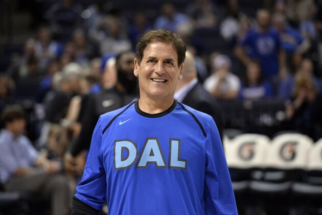 Dallas Mavericks owner Mark Cuban stands on the court in the first half an NBA basketball game between the Mavericks and the Memphis Grizzlies Sunday, April 7, 2019, in Memphis, Tenn. (AP Photo/Brandon Dill)