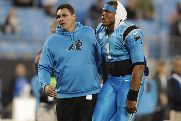 Carolina Panthers head coach Ron Rivera, left, greets Cam Newton, right, before an NFL football game against the New Orleans Saints in Charlotte, N.C., Thursday, Nov. 17, 2016. (AP Photo/Mike McCarn)