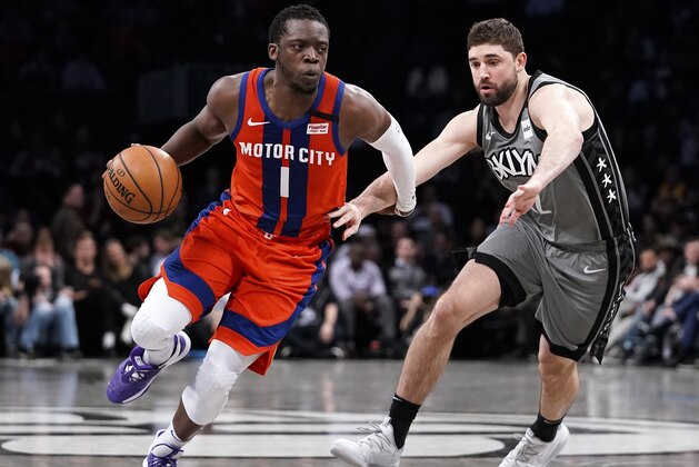 NEW YORK, NY - JANUARY 29:  Reggie Jackson #1 of the Detroit Pistons drives in front of Joe Harris #12 of the Brooklyn Nets in an NBA basketball game on January 29, 2020 at Barclays Center in the Brooklyn borough of New York City. Nets won 125-115. The Nets held a ceremony to honor Basketball great Kobe Bryant and his daughter Gianna who died in a helicopter accident on January 26th. NOTE TO USER: User expressly acknowledges and agrees that, by downloading and/or using this Photograph, user is consenting to the terms and conditions of the Getty License agreement. Mandatory Copyright Notice (Photo by Paul Bereswill/Getty Images)