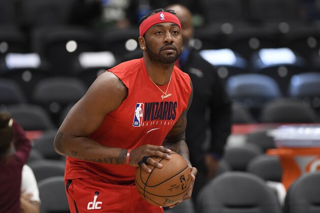 Washington Wizards guard John Wall works out prior to an NBA basketball game against the Milwaukee Bucks, Monday, Feb. 24, 2020, in Washington. (AP Photo/Nick Wass)