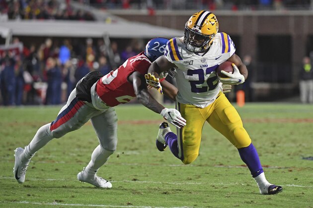 Mississippi defensive back Jalen Julius (26) tackles LSU running back Clyde Edwards-Helaire (22) during the second half of an NCAA college football game in Oxford, Miss., Saturday, Nov. 16, 2019. No. 1 LSU won 58-37. (AP Photo/Thomas Graning)