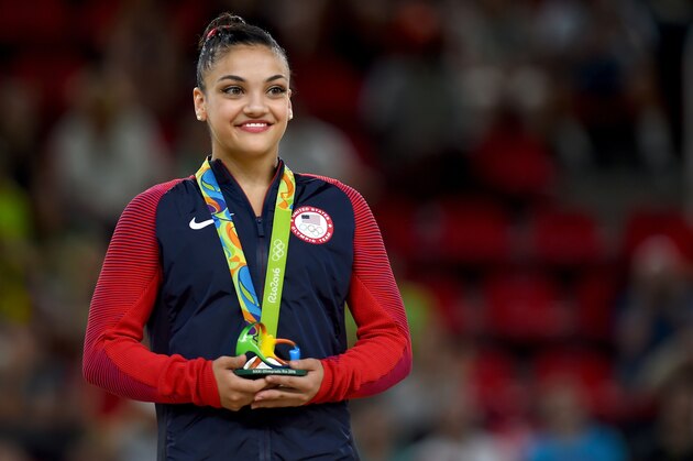RIO DE JANEIRO, BRAZIL - AUGUST 15:  Silver medalist Lauren Hernandez of the United States celeberates on the podium at the medal ceremony for the Balance Beam on day 10 of the Rio 2016 Olympic Games at Rio Olympic Arena on August 15, 2016 in Rio de Janeiro, Brazil.  (Photo by Laurence Griffiths/Getty Images)