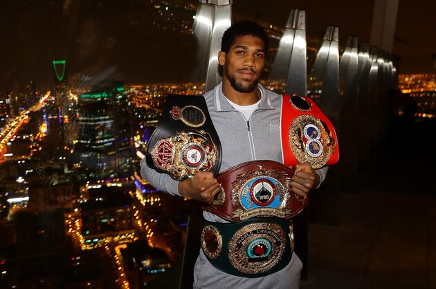 RIYADH, SAUDI ARABIA - DECEMBER 08: Two time Heavyweight Champion of the World, Anthony Joshua, poses for pictures overlooking Riyadh after the IBF, WBA, WBO & IBO World Heavyweight Title Fight between Andy Ruiz Jr and Anthony Joshua at the the Al Faisaliah Hotel on December 08, 2019 in Riyadh, Saudi Arabia. (Photo by Richard Heathcote/Getty Images)