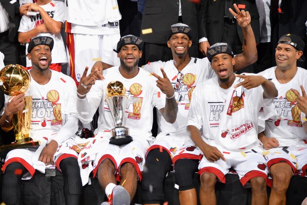 MIAMI, FL - JUNE 20:  (L-R) Dwyane Wade #3, LeBron James #6, Chris Bosh #1, and Norris Cole #30 and Shane Battier #31  during the Larry O'Brien Trophy presentation following the Heat's victory against the San Antonio Spurs in Game Seven of the 2013 NBA Finals on June 20, 2013 at American Airlines Arena in Miami, Florida. NOTE TO USER: User expressly acknowledges and agrees that, by downloading and or using this photograph, User is consenting to the terms and conditions of the Getty Images License Agreement. Mandatory Copyright Notice: Copyright 2013 NBAE (Photo by Jesse D. Garrabrant/NBAE via Getty Images)