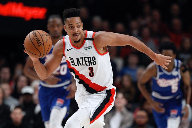 Portland Trail Blazers guard CJ McCollum pushes the ball upcourt against the Sacramento Kings during the first half of an NBA basketball game in Portland, Ore., Saturday, March 7, 2020. (AP Photo/Steve Dipaola)