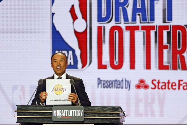 NBA Deputy Commissioner Mark Tatum announces that the Los Angeles Lakers had won the fourth pick during the NBA basketball draft lottery Tuesday, May 14, 2019, in Chicago. (AP Photo/Nuccio DiNuzzo)