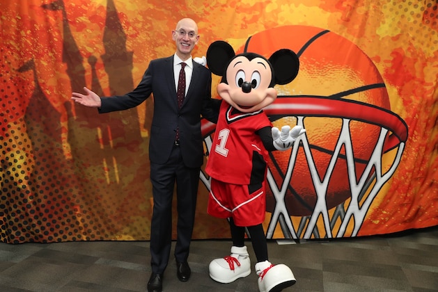 CHARLOTTE, NC - FEBRUARY 15: NBA Commissioner, Adam Silver and Mickey Mouse meet during NBA All Star Weekend in Charlotte, North Carolina on February 15, 2019 at Bojangles Coliseum. The NBA is collaborating with Walt Disney Imagineering on the new NBA Experience opening this summer at Walt Disney World Resort in Florida. This one-of-a-kind destination will bring NBA moments to life through thrilling basketball activities and interactive experiences that will appeal to boys, girls and adults. NOTE TO USER: User expressly acknowledges and agrees that, by downloading and or using this photograph, User is consenting to the terms and conditions of the Getty Images License Agreement. Mandatory Copyright Notice: Copyright 2019 NBAE (Photo by Joe Murphy/NBAE via Getty Images)