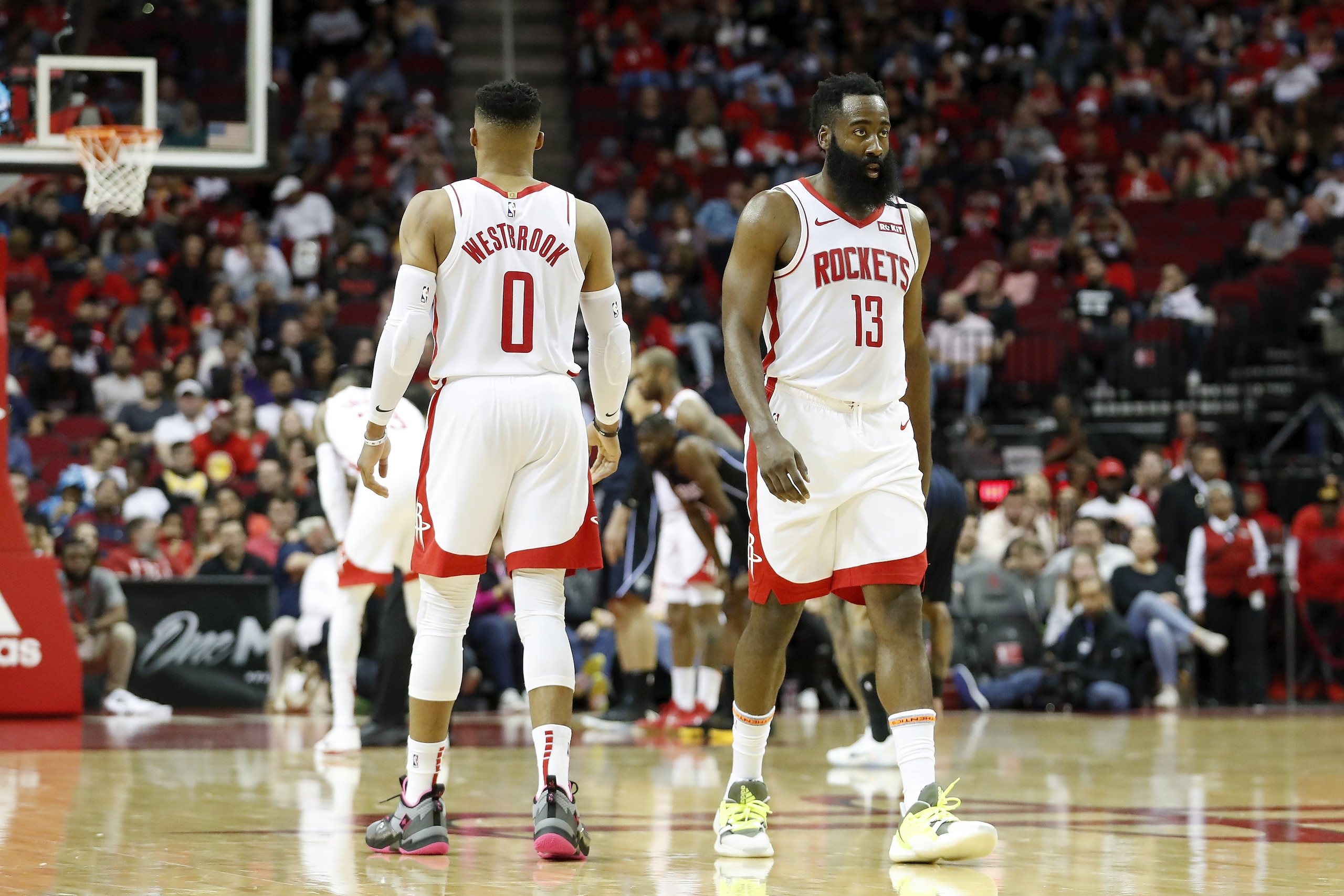 HOUSTON, TEXAS - MARCH 08: James Harden #13 of the Houston Rockets and Russell Westbrook #0 react on the court in the first half against the Orlando Magic at Toyota Center on March 08, 2020 in Houston, Texas. NOTE TO USER: User expressly acknowledges and agrees that, by downloading and or using this photograph, User is consenting to the terms and conditions of the Getty Images License Agreement. (Photo by Tim Warner/Getty Images) HOUSTON, TEXAS - MARCH 08: James Harden #13 of the Houston Rockets and Russell Westbrook #0 react on the court in the first half against the Orlando Magic at Toyota Center on March 08, 2020 in Houston, Texas. NOTE TO USER: User expressly acknowledges and agrees that, by downloading and or using this photograph, User is consenting to the terms and conditions of the Getty Images License Agreement. (Photo by Tim Warner/Getty Images)