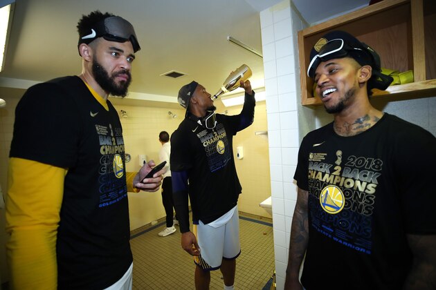 CLEVELAND, OH - JUNE 08: JaVale McGee #1, David West #3 and Nick Young #6 of the Golden State Warriors celebrate in the locker room after defeating the Cleveland Cavaliers during Game Four of the 2018 NBA Finals at Quicken Loans Arena on June 8, 2018 in Cleveland, Ohio. NOTE TO USER: User expressly acknowledges and agrees that, by downloading and or using this photograph, User is consenting to the terms and conditions of the Getty Images License Agreement. The Warriors defeated the Cavaliers 108-85 to win the 2018 NBA Finals.  (Photo by Gregory Shamus/Getty Images)