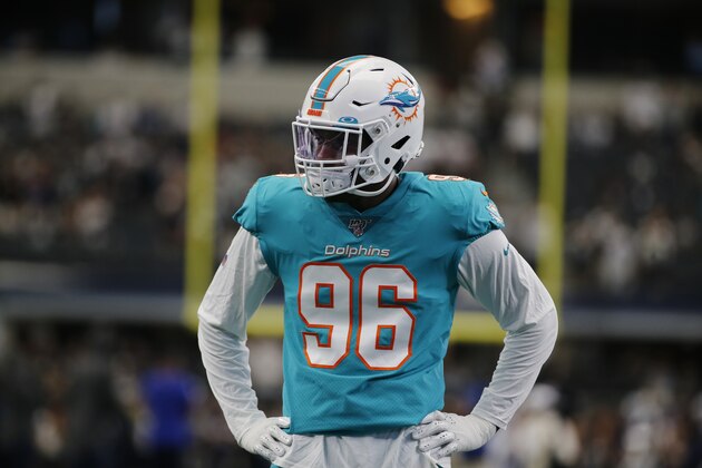 Miami Dolphins defensive end Taco Charlton (96) watches drills prior to a NFL football game against the Dallas Cowboys in Arlington, Texas, Sunday, Sept. 22, 2019. (AP Photo/Michael Ainsworth) Miami Dolphins defensive end Taco Charlton (96) watches drills prior to a NFL football game against the Dallas Cowboys in Arlington, Texas, Sunday, Sept. 22, 2019. (AP Photo/Michael Ainsworth)