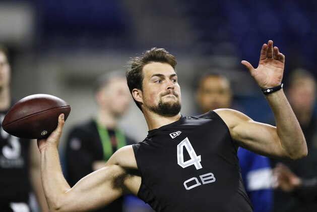 Washington quarterback Jacob Eason runs a drill at the NFL football scouting combine in Indianapolis, Thursday, Feb. 27, 2020. (AP Photo/Charlie Neibergall)