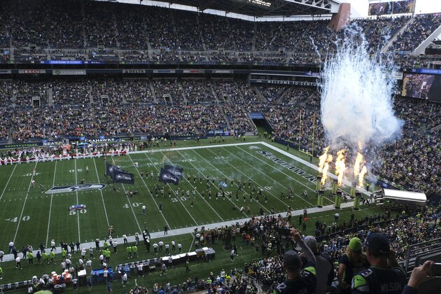 Fire effects go off as Seattle Seahawks players run out of the tunnel at the start of their home opener NFL football game against the Cincinnati Bengals at CenturyLink Field, Sunday, Sept. 8, 2019, in Seattle. (AP Photo/Stephen Brashear)