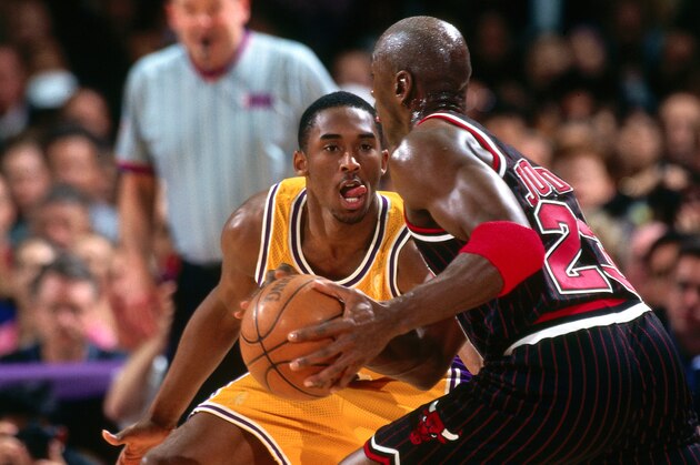 INGLEWOOD, CA - FEBRUARY 5: Michael Jordan #23 of the Chicago Bulls drives against Kobe Bryant #8 of the Los Angeles Lakers on February 5, 1997 at the Great Western Forum in Inglewood, California. NOTE TO USER: User expressly acknowledges and agrees that, by downloading and or using this photograph, User is consenting to the terms and conditions of the Getty Images License Agreement. Mandatory Copyright Notice: Copyright 1997 NBAE (Photo by Andrew D. Bernstein/NBAE via Getty Images)