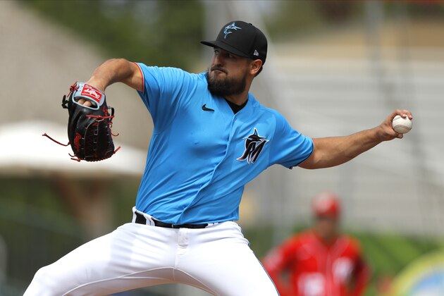 Miami Marlins pitcher Caleb Smith throws to the Washington Nationals during the first inning of a spring training baseball game, Tuesday, March 10, 2020, in Jupiter, Fla. (AP Photo/Julio Cortez)