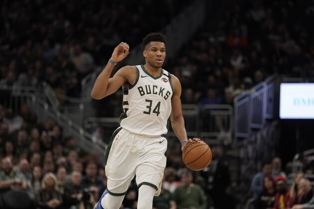 Milwaukee Bucks' Giannis Antetokounmpo dribbles during the second half of an NBA basketball game against the Indiana Pacers Wednesday, March 4, 2020, in Milwaukee. The Bucks won 119-100. (AP Photo/Morry Gash)
