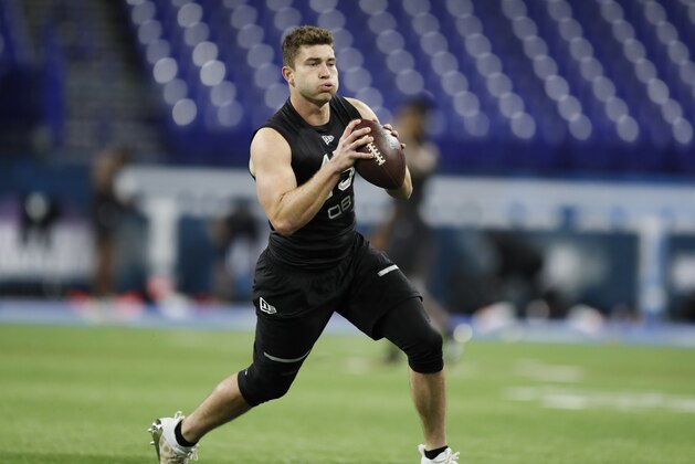 Michigan quarterback Shea Patterson runs a drill at the NFL football scouting combine in Indianapolis, Thursday, Feb. 27, 2020. (AP Photo/Charlie Neibergall)