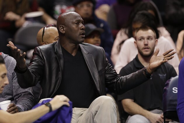 Charlotte Hornets owner Michael Jordan argues a call in the second half of an NBA basketball game against the Chicago Bulls in Charlotte, N.C., Friday, Dec. 23, 2016. The Hornets won 103-91. (AP Photo/Chuck Burton)