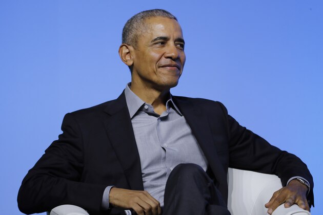Former U.S. President Barack Obama smiles as he attends the Former U.S. President Barack Obama smiles as he attends the