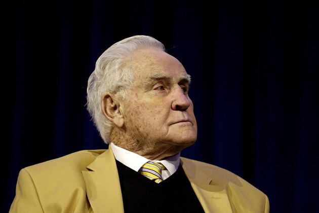 Don Shula watches as  Tuscarora High School coach Michael Burnett speaks after winning the Don Shula high school coach of the year award during a press conference a news conference Friday, Feb. 5, 2016, in San Francisco. (AP Photo/Charlie Riedel)