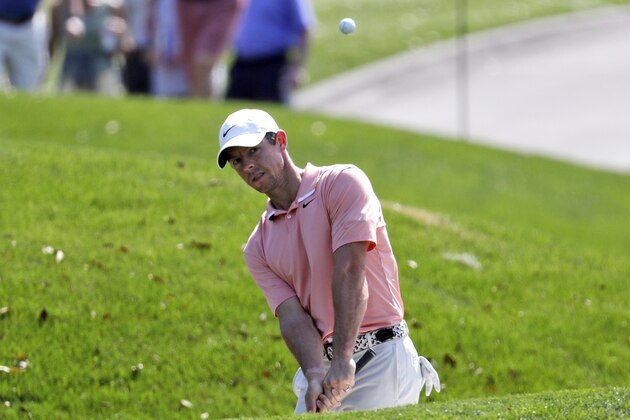 Rory McIlroy hits from a bunker on the ninth hole during a practice round for The Players Championship golf tournament, Wednesday, March 11, 2020, in Ponte Vedra Beach, Fla. (AP Photo/Lynne Sladky)