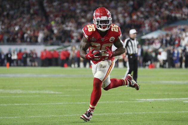 Kansas City Chiefs running back Damien Williams (26) runs the ball in for a touchdown during the second half of the NFL Super Bowl 54 football game between the San Francisco 49ers and Kansas City Chiefs Sunday, Feb. 2, 2020, in Miami Gardens, Fla. The Kansas City Chiefs won 31-20. (AP Photo/Steve Luciano)