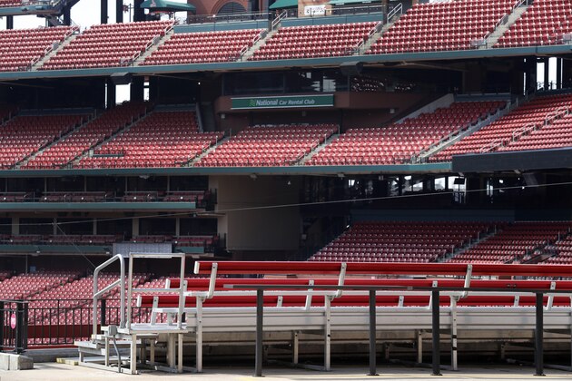 Empty seats are seen seen inside Busch Stadium, home of the St. Louis Cardinals baseball team, Wednesday, March 25, 2020, in St. Louis. The start of the regular season, which was set to start on Thursday, is on hold indefinitely because of the coronavirus pandemic. (AP Photo/Jeff Roberson)