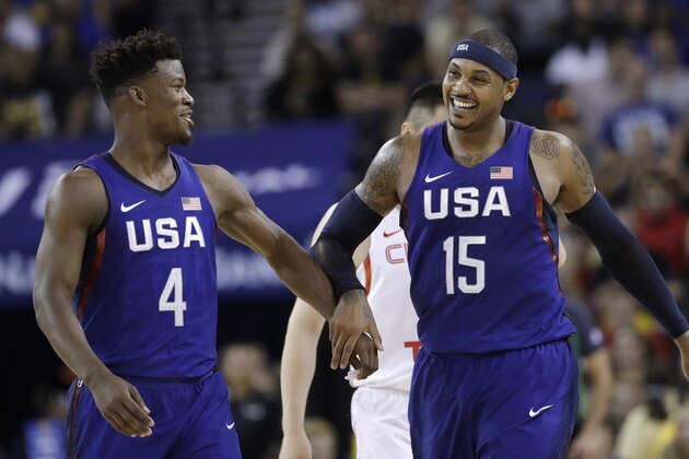 United States' Carmelo Anthony, right, celebrates after scoring, alongside teammate Jimmy Butler during the second half of an exhibition basketball game against China on Tuesday, July 26, 2016, in Oakland, Calif. The United States won 107-57. (AP Photo/Marcio Jose Sanchez)