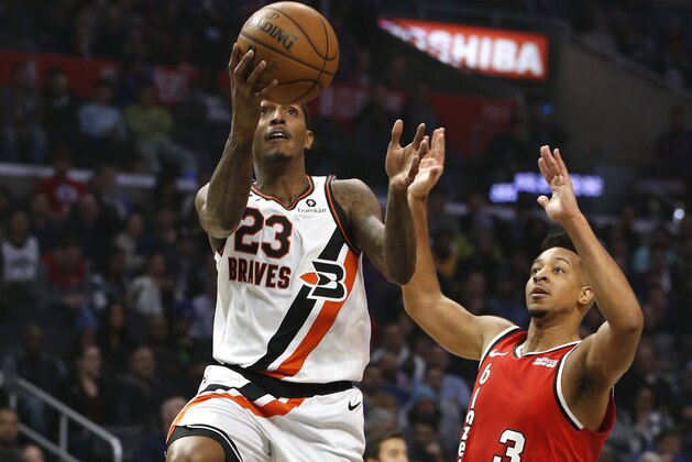 LOS ANGELES, CALIFORNIA - DECEMBER 03:  Lou Williams #23 of the Los Angeles Clippers goes up for a shot as CJ McCollum #3 of the Portland Trail Blazers defends during the first half at Staples Center on December 03, 2019 in Los Angeles, California. NOTE TO USER: User expressly acknowledges and agrees that, by downloading and or using this photograph, User is consenting to the terms and conditions of the Getty Images License Agreement. (Photo by Katharine Lotze/Getty Images)