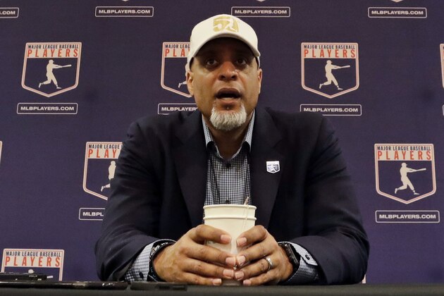 FIEL - In this Feb. 19, 2017, file photo, Tony Clark, executive director of the Major League Players Association, answers questions at a news conference in Phoenix. A proposal collapsed that would have put a runner on second base to start the 10th inning of spring training games, a person familiar with the negotiations told The Associated Press. The person spoke on condition of anonymity Friday because no statements were authorized. Management thinks the union backed off because players were upset Commissioner Rob Manfred described new pace-of-game rules that apply to the regular season as an agreement, the person said. (AP Photo/Morry Gash, File)