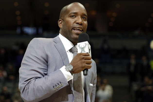 Former Milwaukee Bucks' Michael Redd formally announces his retirement from the NBA, during the first half of an NBA basketball game between the Bucks and the Cleveland Cavaliers on Wednesday, Nov. 6, 2013, in Milwaukee. (AP Photo/Morry Gash)