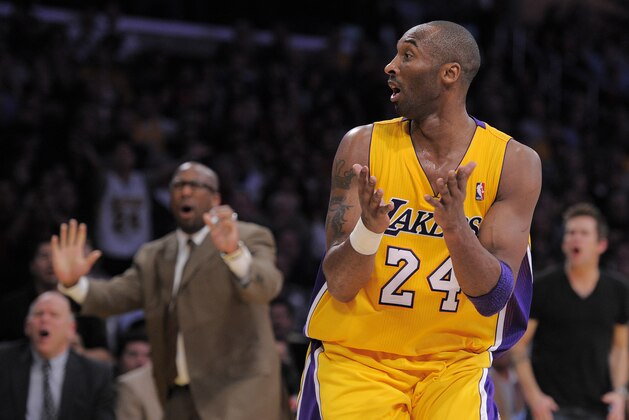 FILE - In this Jan. 25, 2012, file photo, Los Angeles Lakers guard Kobe Bryant, right, reacts along with coach Mike Brown after being called for a technical foul during the second half of the team's NBA basketball game against the Los Angeles Clippers in Los Angeles. The Lakers won 96-91. Brown has embraced getting another shot coaching a team like Golden State. A moment Brown knows might be most temporary. Warriors coach Steve Kerr, who had another procedure last Friday, May 5, 2017, for a spinal fluid leak, might be back before this postseason ends. He might not. Brown has coached some of the game's biggest stars, from LeBron James to Bryant to now Stephen Curry and Kevin Durant. (AP Photo/Mark J. Terrill, File)