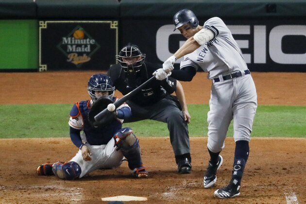 New York Yankees' Aaron Judge hits a two-run home run against the Houston Astros during the fourth inning in Game 2 of baseball's American League Championship Series Sunday, Oct. 13, 2019, in Houston. (AP Photo/Sue Ogrocki)