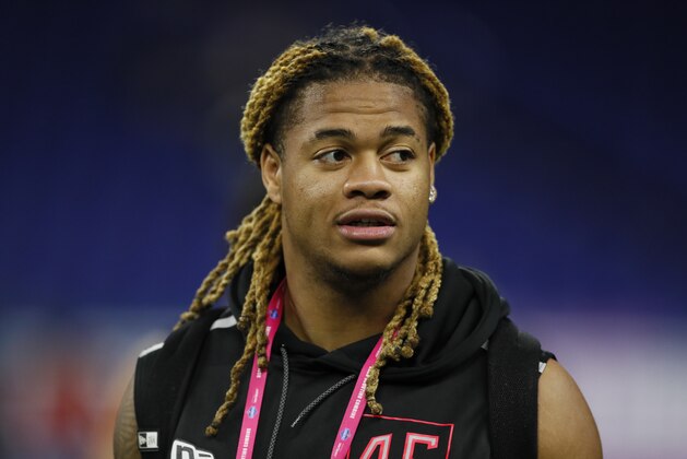 Ohio State defensive lineman Chase Young watches a drill at the NFL football scouting combine in Indianapolis, Saturday, Feb. 29, 2020. (AP Photo/Charlie Neibergall)