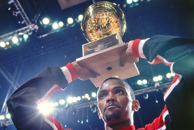 CHARLOTTE - FEBRUARY 9: Craig Hodges #14 of the Chicago Bulls holds the trophy during the 1991 NBA Three Point Contest as part of NBA All Star Weekend on February 9, 1991 at the Charlotte Coliseum in Charlotte, North Carolina. NOTE TO USER: User expressly acknowledges and agrees that, by downloading and/or using this Photograph, user is consenting to the terms and conditions of the Getty Images License Agreement. Mandatory Copyright Notice: Copyright 1991 NBAE (Photo by Nathaniel S. Butler/NBAE via Getty Images)