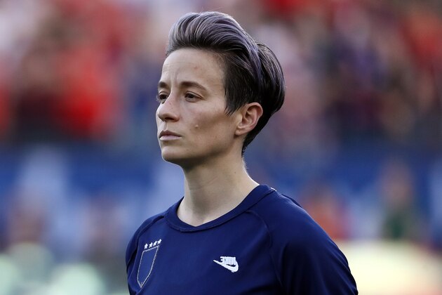 FRISCO, TEXAS - MARCH 11:  Megan Rapinoe #15 of the United States during the national anthem before the 2020 SheBelieves Cup match against Japan at Toyota Stadium on March 11, 2020 in Frisco, Texas. (Photo by Ronald Martinez/Getty Images)