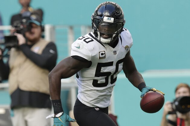 Jacksonville Jaguars outside linebacker Telvin Smith (50) runs for a touchdown after intercepting a pass, during the second half at an NFL football game against the Miami Dolphins, Sunday, Dec. 23, 2018, in Miami Gardens, Fla. (AP Photo/Brynn Anderson)