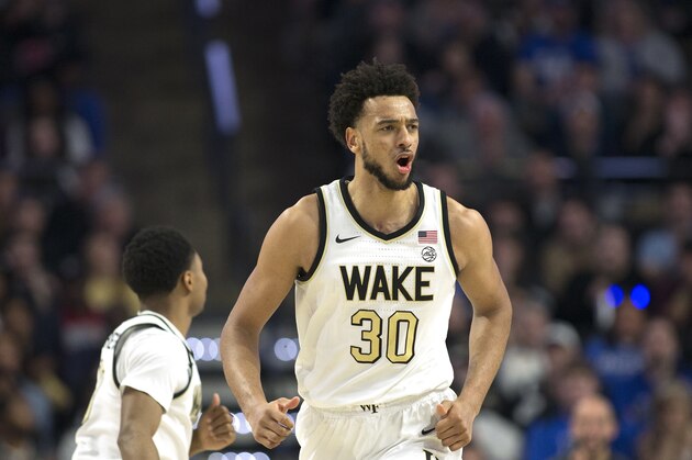 Wake Forest center Olivier Sarr (30) reacts afters scoring in the second half of an NCAA college basketball game Tuesday, Feb. 25, 2020, in Winston-Salem, N.C. (AP Photo/Lynn Hey)